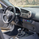 Illustration for article titled Some Genius Swapped a Honda Civic Si Motor Into a 220,000 Mile Honda Insight Hybrid